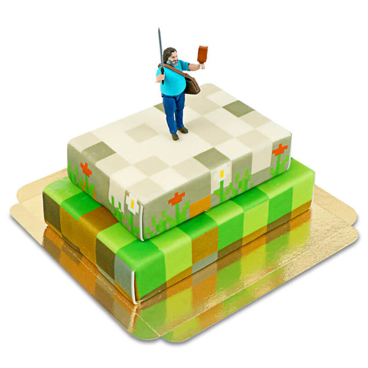 Minecraft®-Figur auf zweistöckiger Spielewelt-Torte